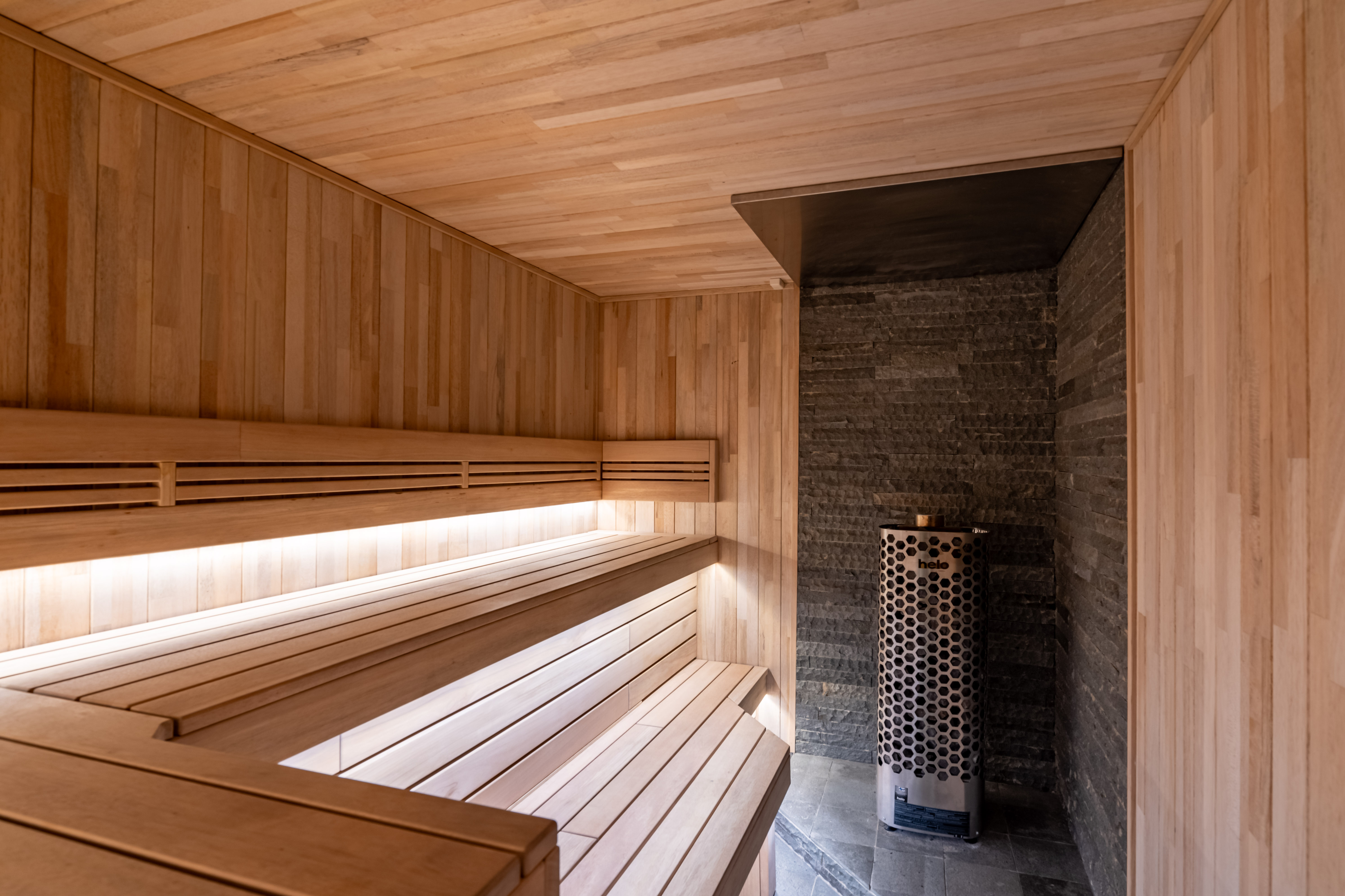 Sauna — wood-paneled interior with helo heater